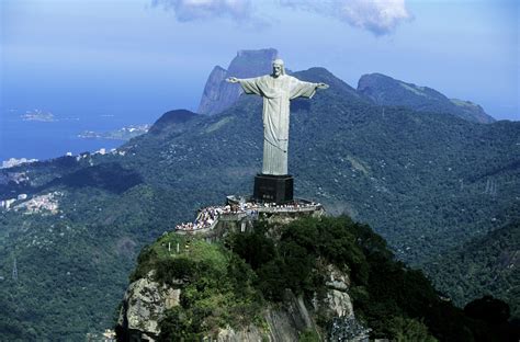 the statue of christ the redeemer looks over this city